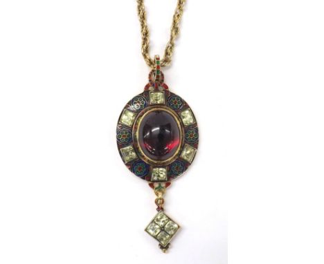 Rare 19th century Holbeinesque gold and enamel oval pendant, the central cabouchon garnet set within foliate decorated enamel
