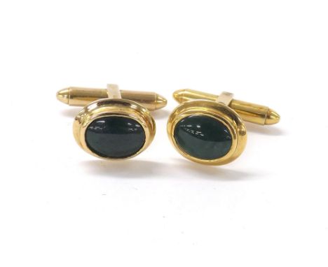 Pair of 14ct oval cufflinks inset with green jade, stamped 585, 7.8gm, 14mm x 12mm (133529-2-A)