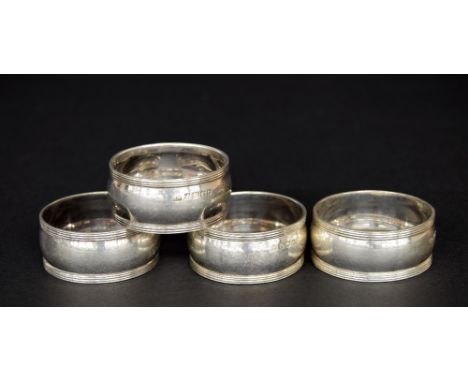 Set of four Victorian silver napkin rings, each numbered, Sheffield 1885, maker Harrison Brothers & Howson, 2.2oz approx (4) 