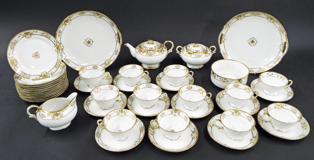 Noritake tea set for twelve decorated with floral sprays and gilding comprising cups with saucers