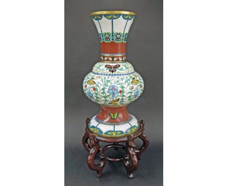 Large Chinese cloisonne vase on stand, with butterfly and scroll design, upon ornate hardwood base, vase 20" high, 28" includ