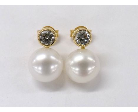 Pair of 18ct yellow gold cultured pearl diamond earrings, estimated 0.65ct approx, the pearls 10mm diameter
