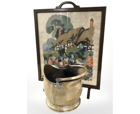 A tapestry fire screen and a Victorian brass coal helmet.