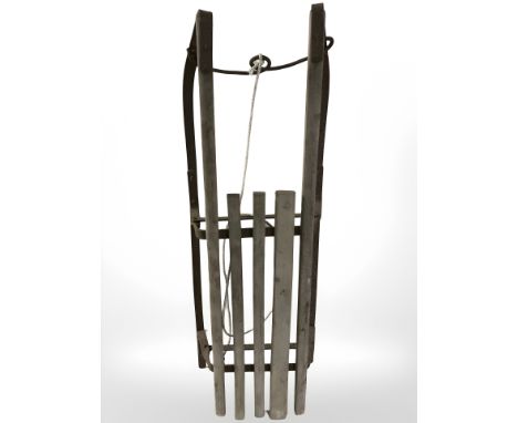 An early 20th century child's sledge, length 89 cm.