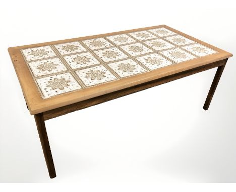 A Danish tile inset rectangular coffee table, 133 cm x 72 cm x 50 cm.