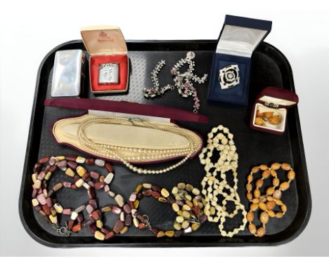 A group of costume jewellery including beaded necklaces, Ronson lighter, lotus pearl three strand necklace, etc.