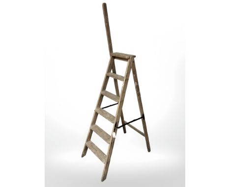 An early 20th century folding pine step ladder 