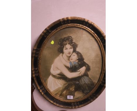 AN OVAL PRINT IN A GILT AND EBONISED FRAME, mother and child 