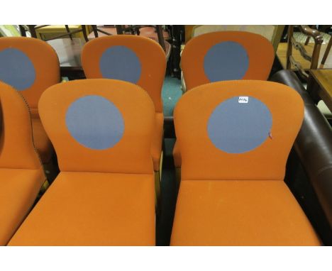 A SET OF SIX MODERN UPHOLSTERED DINING ROOM CHAIRS OF LARGE PROPORTIONS the orange felt upholstered backs centred by a blue p