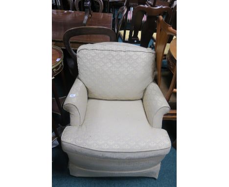 A LIGHT GREEN AND BEIGE UPHOLSTERED ARMCHAIR, with loose cushions and scrolled arms.