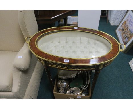 A CONTINENTAL STYLE KINGSWOOD AND GILT BRASS MOUNTED DISPLAY CABINET the two handled oval shaped top with bevelled glass pane