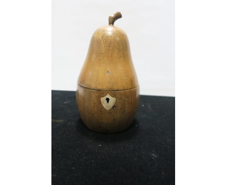 A FRUITWOOD TEA CADDY IN THE FORM OF A PEAR, 22cms high.