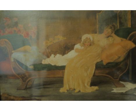 A COLOURED PRINT depicting a Victorian mother and child on a chaise longue in a gilt frame 18cm x 24cm