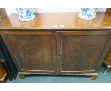 A GEORGIAN MAHOGANY CUPBOARD, the rectangular top above panelled doors, containing shelves on bracket feet, 95cms x 122cms x 