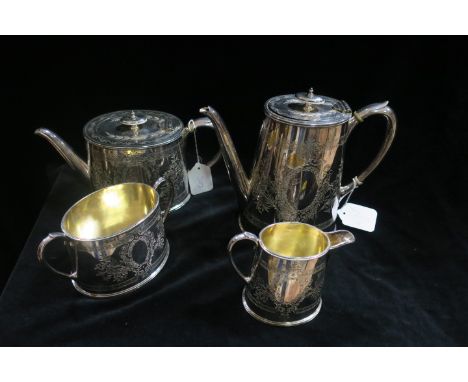 A FOUR PIECE SILVER PLATED EMBOSSED TEA AND COFFEE SERVICE.