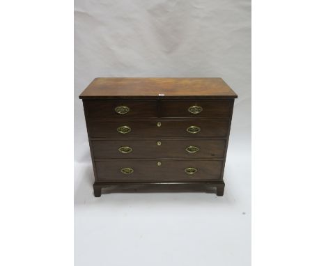 19th CENTURY MAHOGANY CHEST OF DRAWERS the rectangular top above two short and three long cock beaded drawers with oval brass