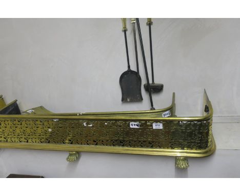 A PAIR OF BRASS FENDERS OF TYPICAL FORM together with a fire set  with reeded and fluted panel together with a brass fire set