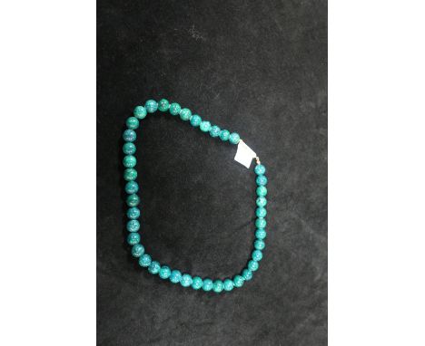 A JADE NECKLACE.