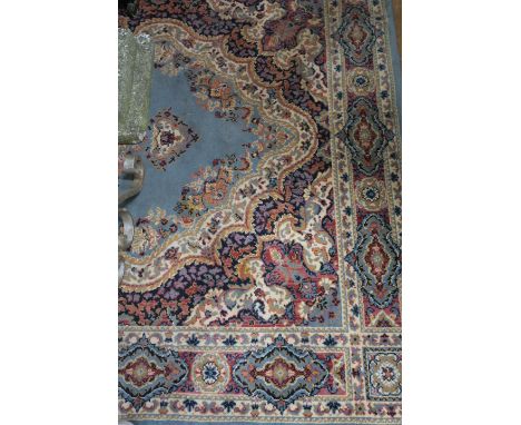 A RECTANGULAR WOOL RUG, the grey ground with central classical shaped panel filled overall with foliate motifs and beige bord