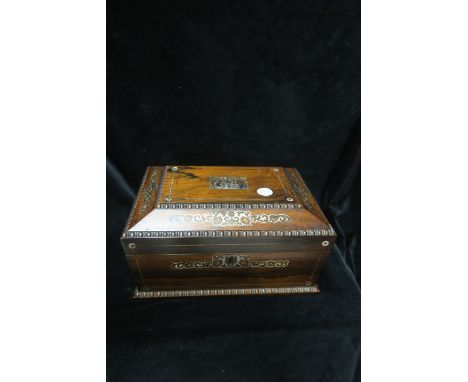 A ROSEWOOD AND MOTHER OF PEARL INLAID DRESSING TABLE BOX, of rectangular form and sloping sides and bobbin turned rim, with b