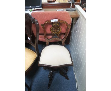 A GOOD EDWARDIAN MAHOGANY AND MARQUETRY MUSIC CHAIR, the shaped scrolled top rail above a panelled splat with upholstered sea