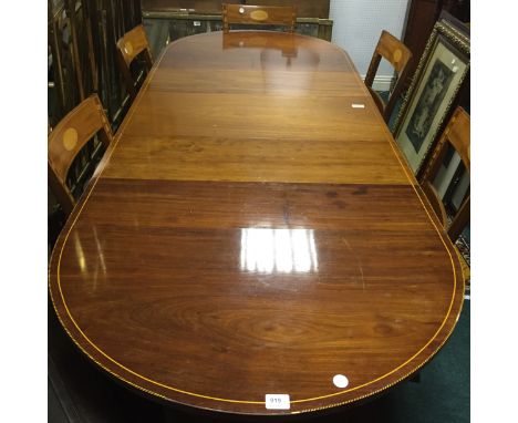 AN EIGHT PIECE SHERATON STYLE MAHOGANY AND SATINWOOD INLAID DINING ROOM SUITE, comprising of a D end table with two loose lea