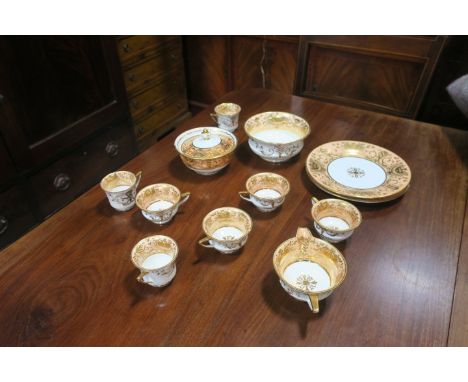 A GLAZED PORCELAIN PART TEASET, the white ground with salmon pink and gilded interior comprising teapot, cups, saucers, sugar