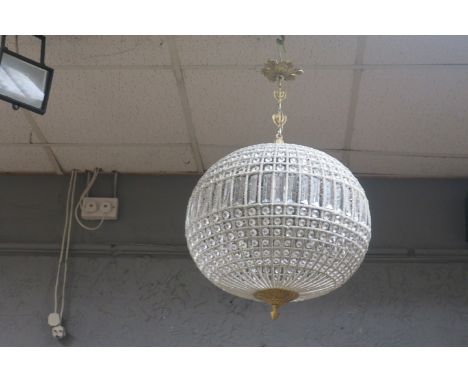 AN ART DECO STYLE CUT GLASS AND BRASS FRAMED PENDANT LIGHT, the open beadwork circular shade filled with cut glass pendants.