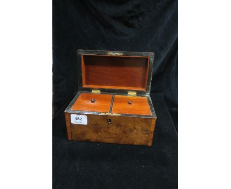 A GEORGIAN WALNUT AND KINGWOOD CROSSBANDED TEA CADDY, with lidded compartments.