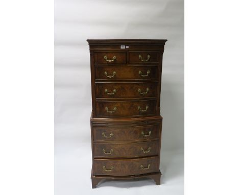 A GEORGIAN STYLE WALNUT AND MAHOGANY FRAMED CHEST ON CHEST the moulded cornice above a plain frieze with two short and three 