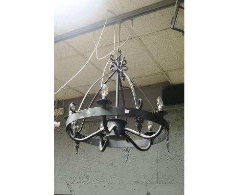 A CONTINENTAL STYLE CIRCULAR FRAMED LIGHT FITTING the tubular support above the circular open frame fitted with five scrolled