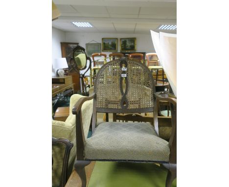 A PAIR OF BEECH WOOD AND CANE BACK LOW CHAIRS, each with a curved top rail with caned panel and upholstered seat with moulded