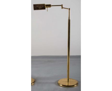 A BRASS ADJUSTABLE READING LAMP, 1970s, on circular base, 100 cm (h) x 38 (d).