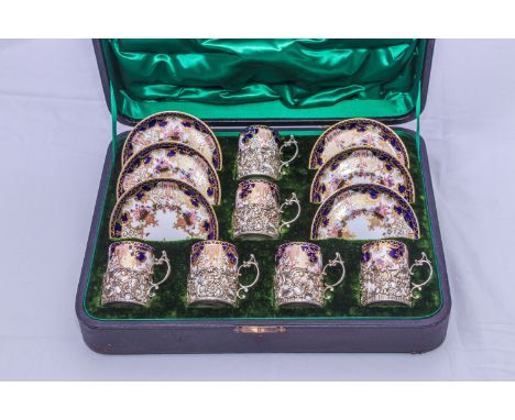 Royal Crown Derby silver mounted coffee cans and saucers in leather case