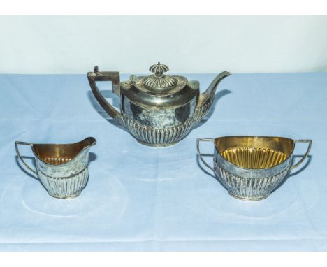 A silver three piece tea service marks for Birmingham various years