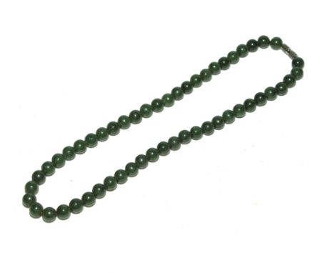 A string of vintage jade beads