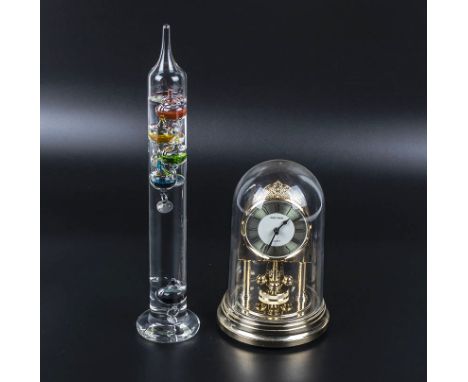 A Galileo thermometer and an Anniversary clock 