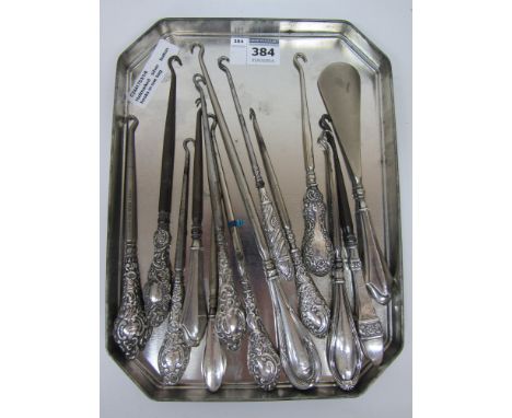Various Victorian and later button hooks and shoe horn with hallmarked silver handles