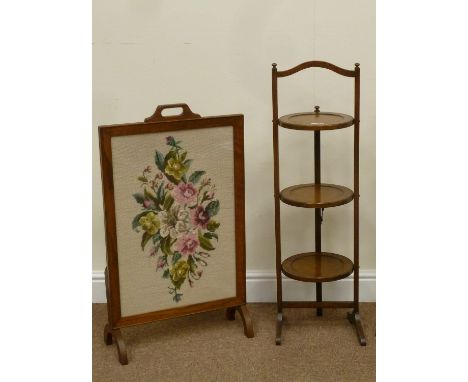 20th century golden oak three tier folding cake stand (H92cm), and an oak framed firescreen fitted with needlework tapestry p