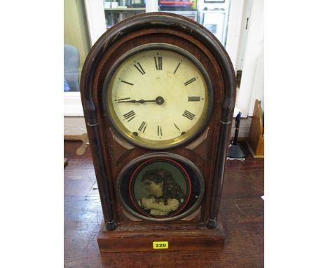 A mid 20th century mahogany cased mantel clock with a pictorial plate