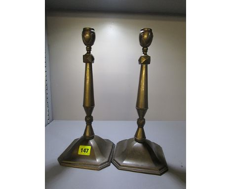 A pair of early 20th century bronze candlesticks with tapered stems on splayed foot, 13 1/2 h