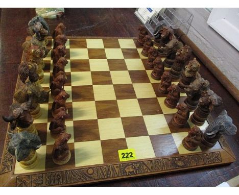 A Gala Star African carved chess set with animal pieces