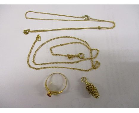A yellow metal ring set with a ruby, stamped 875, yellow metal necklaces and a pendant