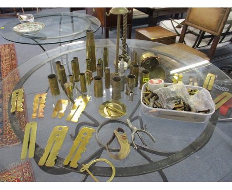 Trench art, bullet shells, a brass table lamp, a horse stirrup and brassware