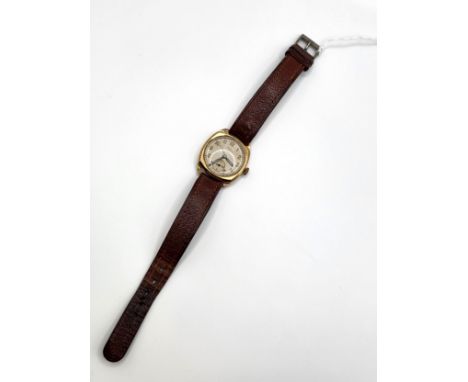 A vintage Limit Sports 1940's 9ct gold wristwatch. 29.5mm case on a brown leather strap.