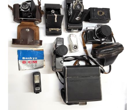 A collection of antique and vintage cameras and accessories including a Voiglander, a Kodak ball bearing shutter, A Kodak num