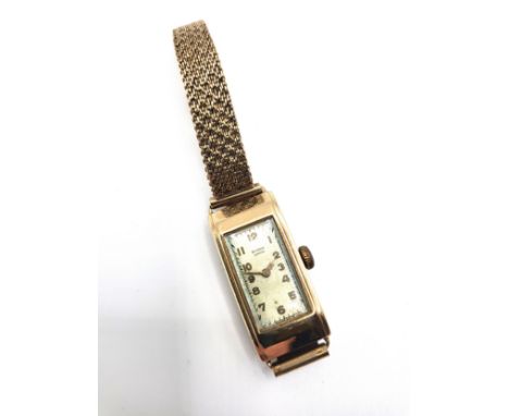 A 9ct yellow gold Benson London ladies watch. Oblong face. 17gms all in.