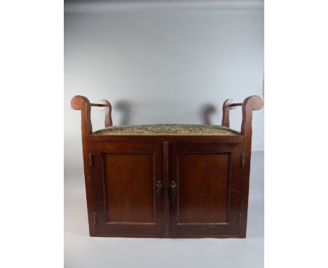 An Edwardian Mahogany Tapestry Topped Piano Stool with Panelled Doors which Open to Reveal Two Sort and Two Long Drawers. 79c