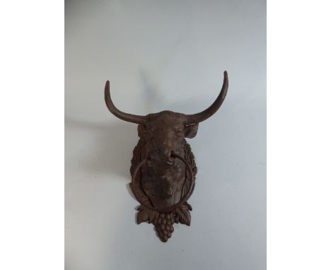 A Cast Metal Wall Mounting Wall Tie in the Form of a Cows Head, 26cm high