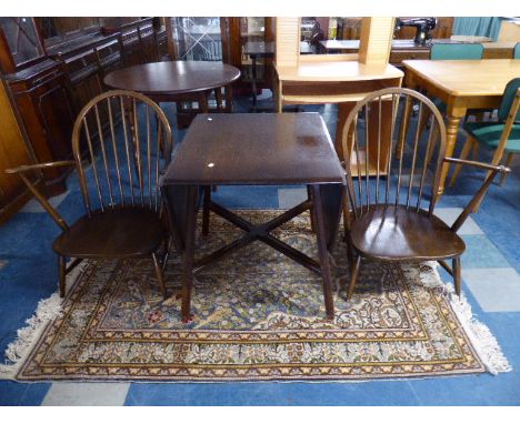 An Ercol Drop Leaf Dining Table and Pair of Armchairs 